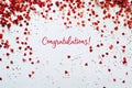 Congratulations text on white background with red confetti Royalty Free Stock Photo