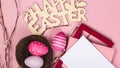 congratulatory post card with easter eggs and with blank white note on the pink background and rabbit ears and place for text top Royalty Free Stock Photo