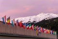 The congress center in Davos with flags of nations at sunrise during the WEF World Economic Forum