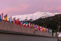 The congress center in Davos with flags of nations at sunrise during the WEF World Economic Forum