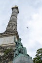 Congress Column, Brussels Belgium with aeroplane flying over head Royalty Free Stock Photo