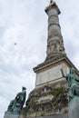 Congress Column, Brussels Belgium with aeroplane flying over head Royalty Free Stock Photo