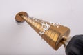 Conical drill used for small housework. Drilling in plastic with tool steel drills Royalty Free Stock Photo