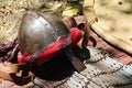 Conical helmet with nosepiece and middle east arabic type of decoration, early plate armor and kite shield