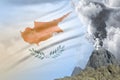 Conical volcano blast eruption at day time with white smoke on Cyprus flag background, problems of natural disaster and volcanic