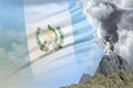 conical volcano eruption at day time with white smoke on Guatemala flag background, suffer from disaster and volcanic earthquake