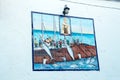 Conil de la Frontera, Spaine - July 20, 2018: mosaic picture with scenes of fishing and a large catch of fish on wall of building