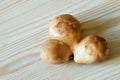 Conjoined siamese potato wooden table background with copy space. Potential use as wonky funny ugly vegetable or food