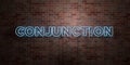 CONJUNCTION - fluorescent Neon tube Sign on brickwork - Front view - 3D rendered royalty free stock picture