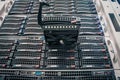 Connect a new hard drive to a stack of computer servers. Replacing a module in a powerful server hardware. Cloud Storage