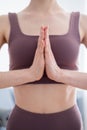 Hands in namaskar mudra in front of the chest
