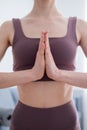 Hands in namaskar mudra in front of the chest