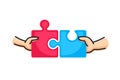 Connect two puzzle pieces. Hands putting two puzzle pieces together. Family concept. Royalty Free Stock Photo