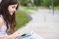 Connected. Hipster woman using digital tablet computer.