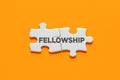 Connected puzzle pieces with the word fellowship. Cooperation, partnership, solidarity and support in business