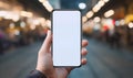 Connected Realities: Man's Hand Holds Vertical Smartphone Amidst Blurred Background