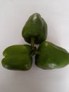 connectedness and love, green peppers on white background