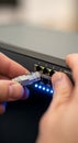 Connecting an Ethernet Cable to a Network Switch, network infrastructure concept Royalty Free Stock Photo