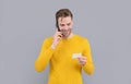 Connecting always. Happy man hold card talking on cellphone. Contact card. Mobile communication