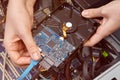 Connecting hard drive to motherboard in computer system unit. Royalty Free Stock Photo