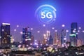 The internet network on the 5G technology system on business buildings and skyscrapers as the business center of the city of Royalty Free Stock Photo