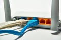 Connecting to a router, network cables connected to a router. Royalty Free Stock Photo