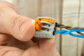 Connecting the twisted ends of the wires using compact splicing connector