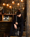 Connection through music. Guy sits thoughtful dreamy in cozy warm atmosphere. Man bearded musician enjoy evening with Royalty Free Stock Photo