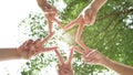 Connection people concept. Five peoples raise two fingers together as a star to convey the cooperation in the work.