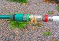 Connection of water pipe and a garden hose with a valve overlap Royalty Free Stock Photo