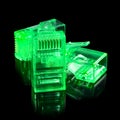 Connector rj-45. Three neon green transparent connectors rj45 for network and internet. Close-up macro isolated on black