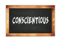 CONSCIENTIOUS text written on wooden frame school blackboard