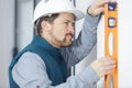 conscientious workman using spirit level Royalty Free Stock Photo