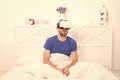 Conscious awakening. Return to reality. Man explore vr while relaxing in bed. VR technology and future. VR communication