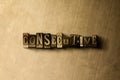 CONSECUTIVE - close-up of grungy vintage typeset word on metal backdrop