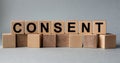 CONSENT, the inscription on wooden cubes on a white background