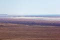 Consequences of Aral sea ecological catastrophe. Salt storm in sandy salt desert on the place of former bottom of drying Aral sea Royalty Free Stock Photo