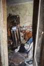 Consequences after a short circuit, burnt house interior, damaged apartment after fire, burned room, charred furniture, household