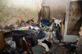 Consequences after a short circuit, burnt house interior, damaged apartment after fire, burned room, charred furniture, household Royalty Free Stock Photo