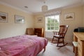 Conservatively furnished traditional bedroom