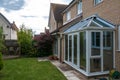 Conservatory and view of back garden, UK Royalty Free Stock Photo