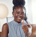 Consider it fixed. a young woman using a headset and showing thumbs up in a modern office. Royalty Free Stock Photo
