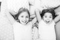 Consider theme slumber party. Slumber party timeless childhood tradition. Girls relaxing on bed. Slumber party concept Royalty Free Stock Photo