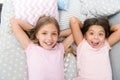 Consider theme slumber party. Slumber party timeless childhood tradition. Girls relaxing on bed. Slumber party concept Royalty Free Stock Photo