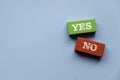 Consider Yes Or No Decisions When Making Business Decisions in Tough Circumstances. Wooden color with yes and no sign Royalty Free Stock Photo