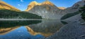 Nature Landscape with View of Glacier Lake Ibon de Plan Basa de la Mora with reflections in the water in Pyrenees, Aragon, Spain