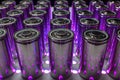 A consignment of new modern high-capacity lithium-ion cells. A prototype of new batteries on a laboratory table with UV light Royalty Free Stock Photo