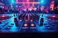 console DJ mixer with turntable in nightclub in booth at night party against background of people dancing under Royalty Free Stock Photo