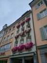 Constance, Germany - August 24, 2019: View of the architecture of the city of Constanz. Bright white and pink flowers adorn the