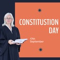 Constitution day text in white on orange and senior caucasian female attorney in gown with book